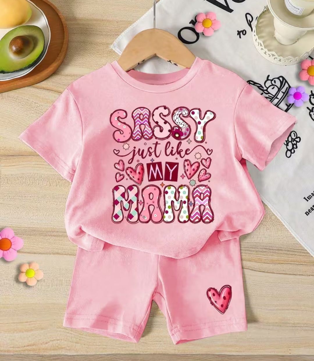 Sassy Just Like My Mama pink baby t-shirt and shorts set on hanger