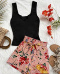 Floral shorts and black ribbed vest top co-ord set laid flat