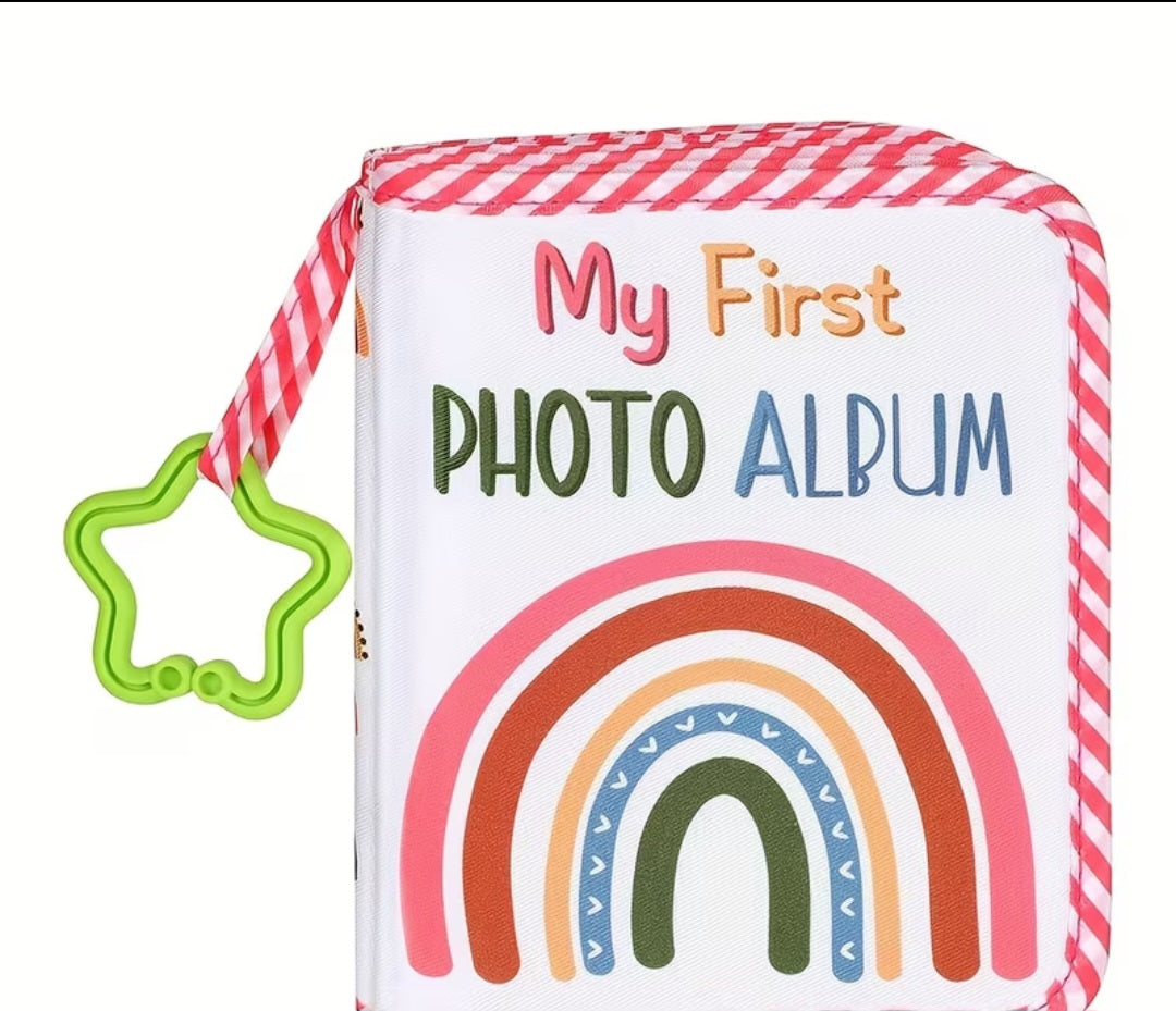 My First Photo Album soft baby book with rainbow design, pink gingham trim and green star teething ring clip
