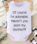 White sleeveless baby vest with funny slogan 'Of course I'm adorable, Haven't you seen my mother?'