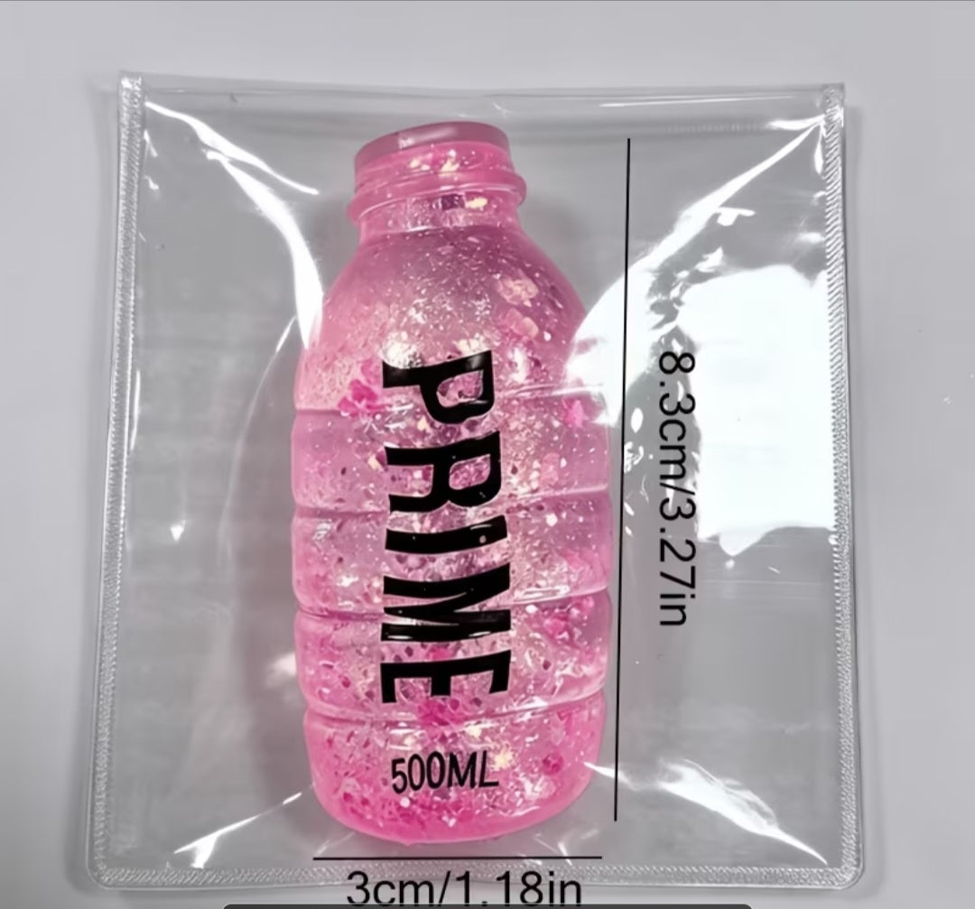 Pink Prime bottle shaped glitter stress toy in clear PVC pouch, 8.3cm tall