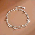 Double layer silver heart charm bracelet with ball bead detailing
